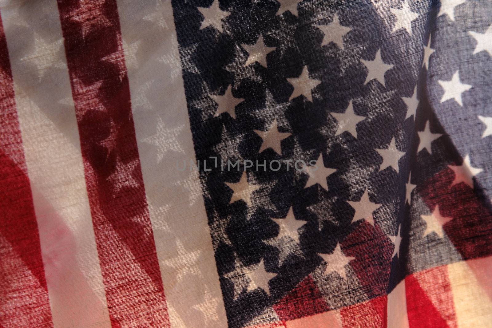 two backlit American flags in a unique view of the stars and stripes