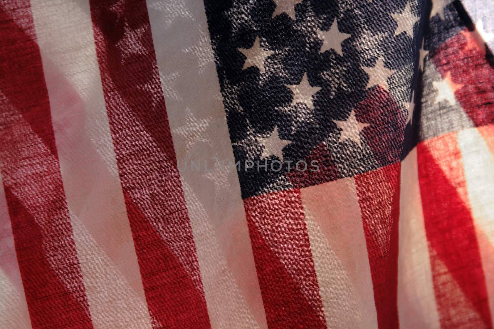 two backlit American flags in a unique view of the stars and stripes
