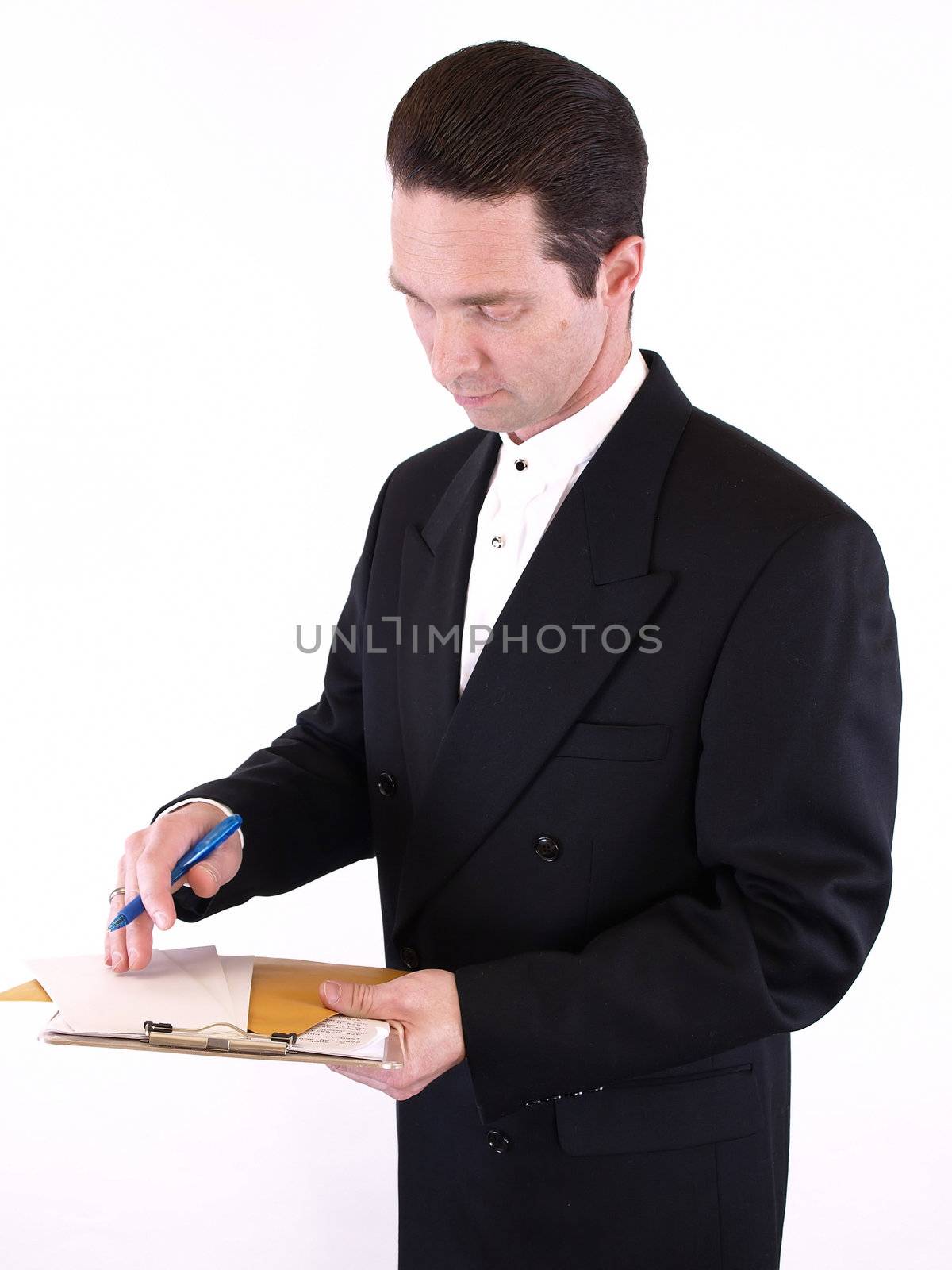 Adult male in a suit holding a clipboard with envelopes and a pen. Isolated on a white background.
