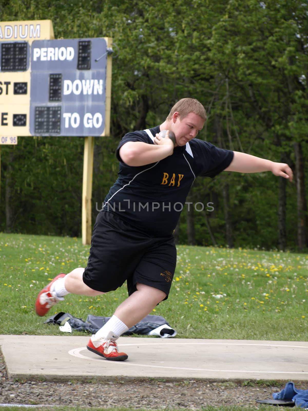 Shot Put Wind Up by RGebbiePhoto