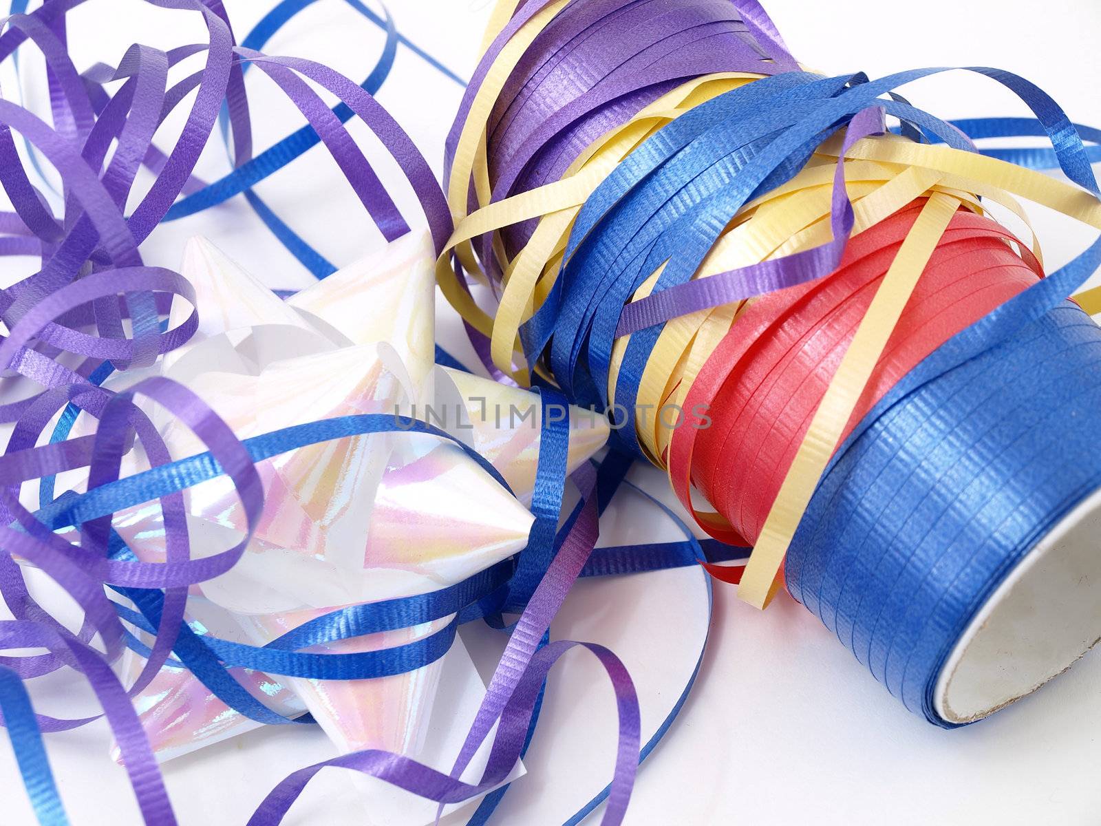 A tangle of colorful ribbons isolated against a white background.