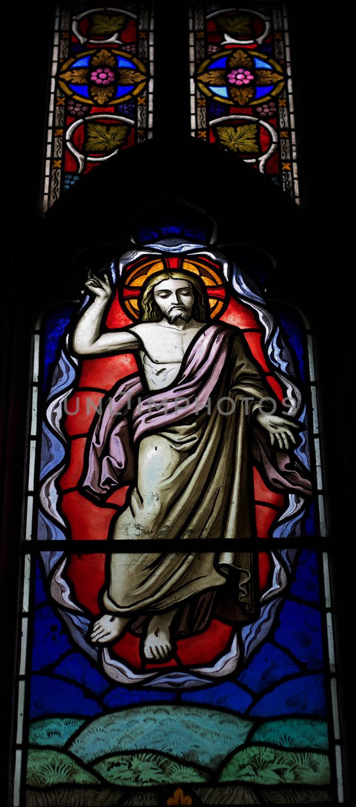 detail of victorian stained glass church window in Fringford depicting Jesus ascending to heaven