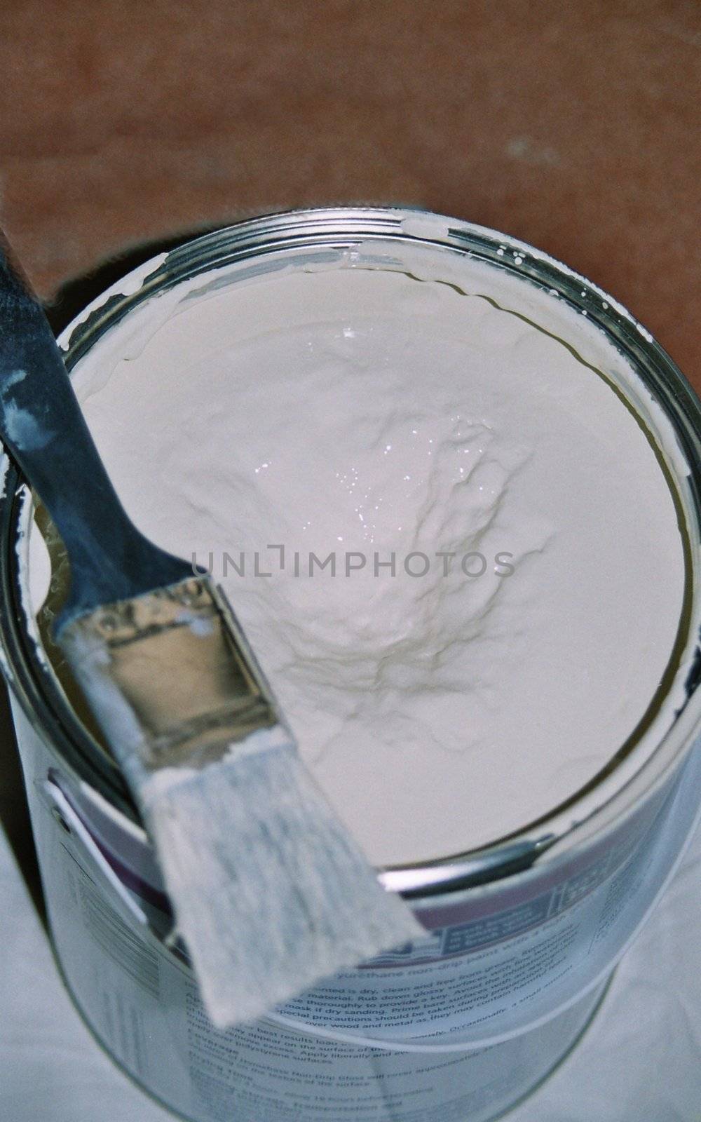 pot of white paint ready to be used