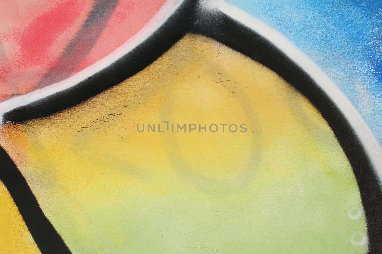Very abstract detail of a graffiti on a metal surface. Lots of copy space in the center