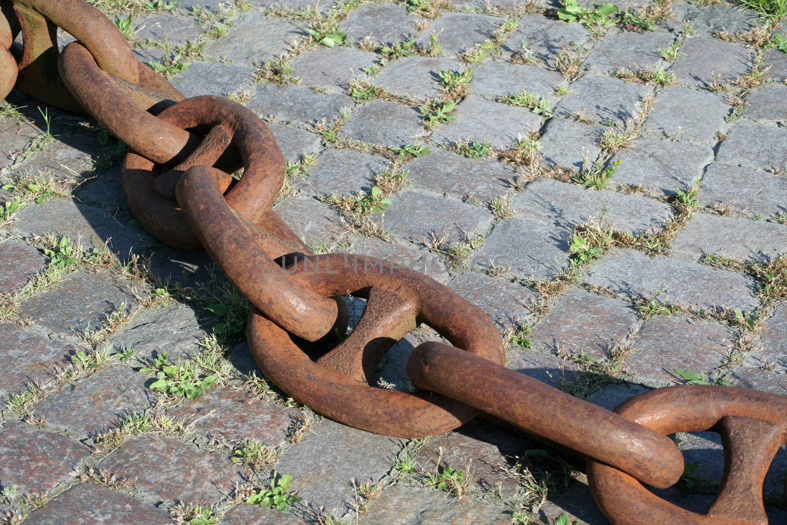 A very heavy rusty anchor chain in the harbour of Hamburg. Not in use anymore.