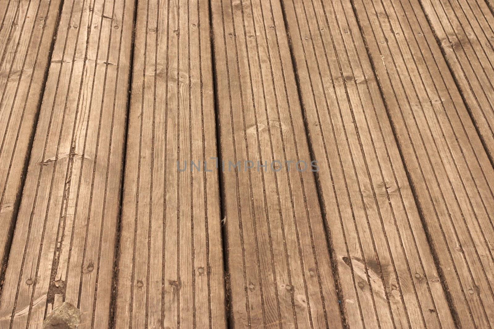 old, weathered wooden floor with perspective, taken outdoors