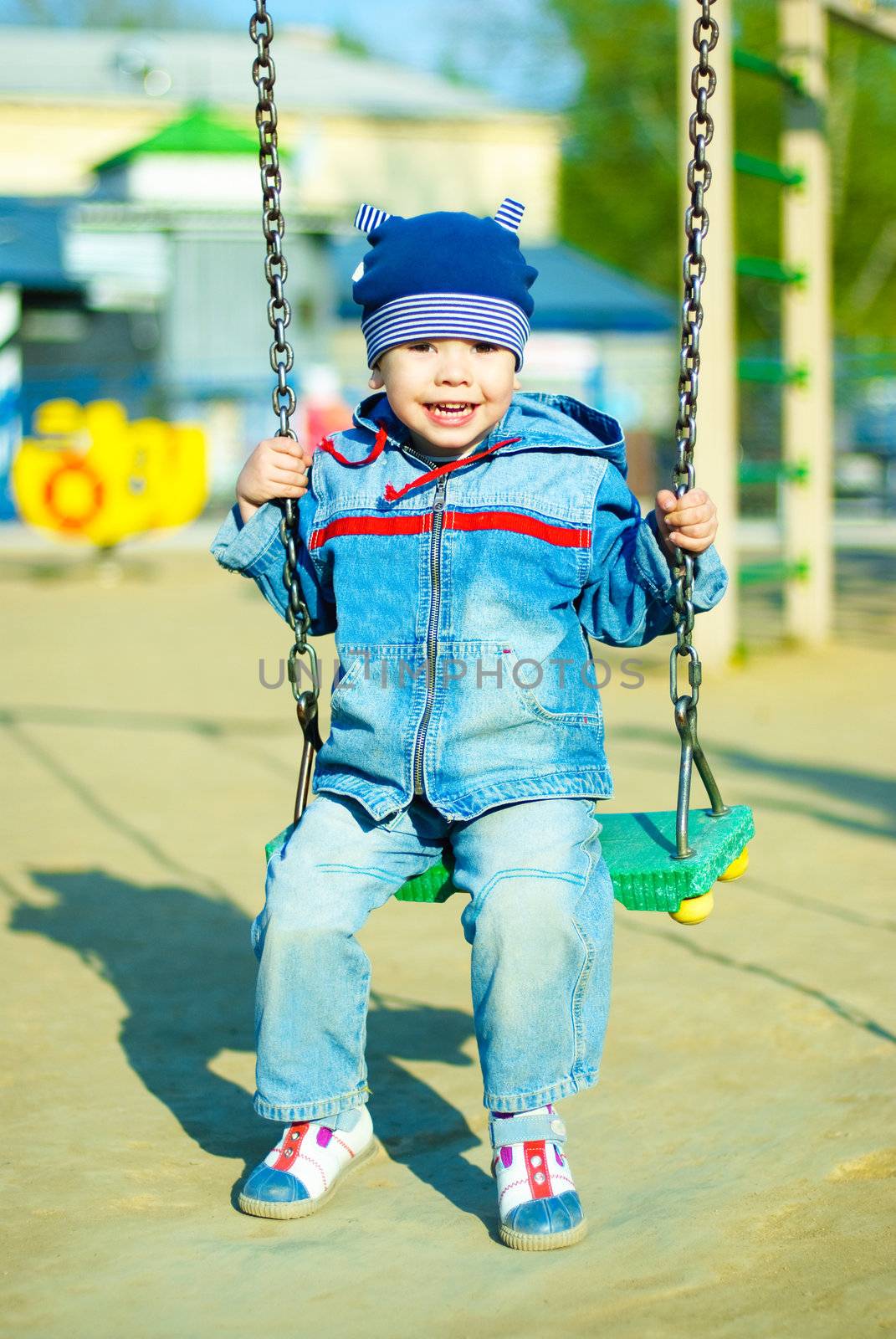 cute three year old boy having fun in the park outdoor