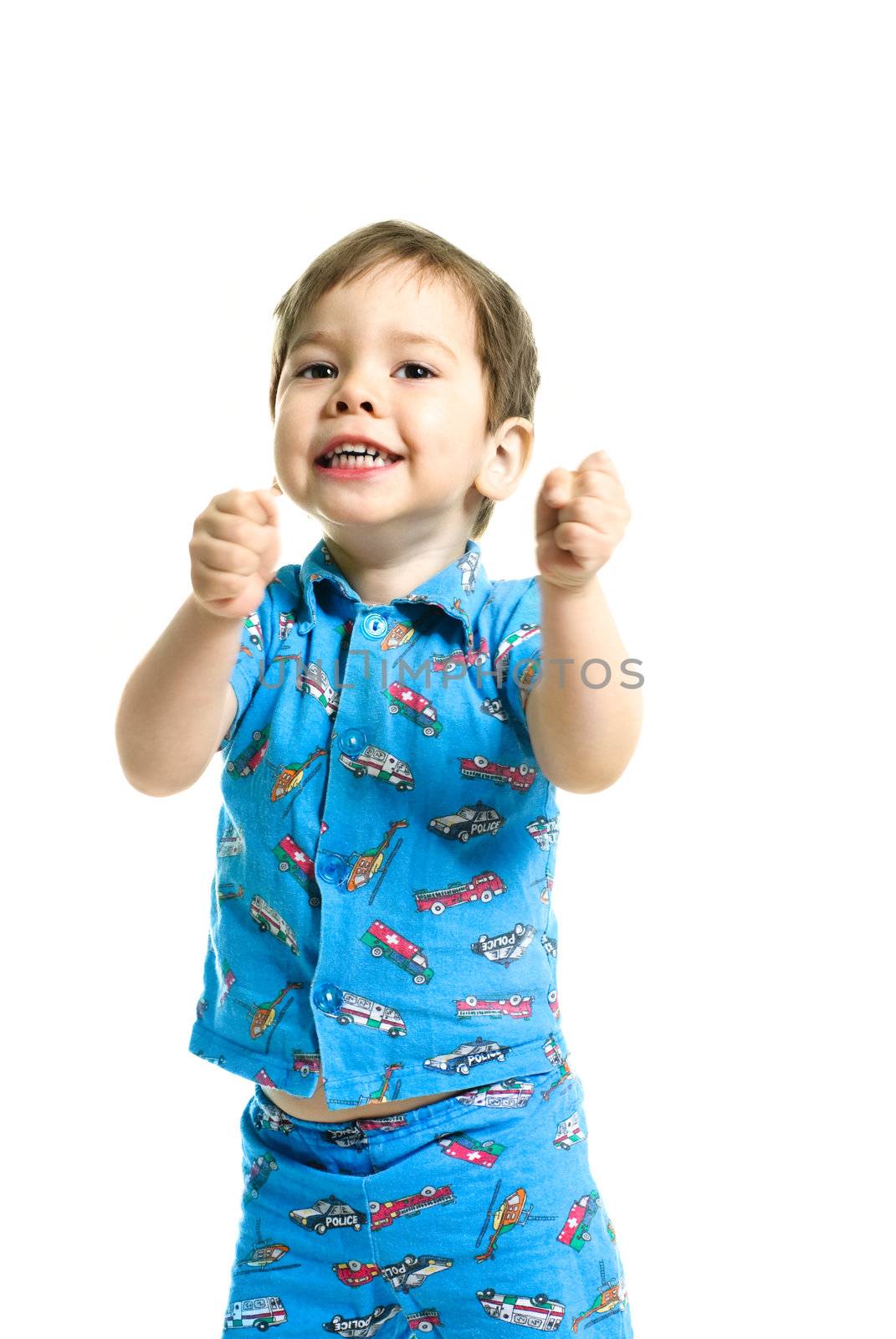 cute excited three year old boy with his hands up  