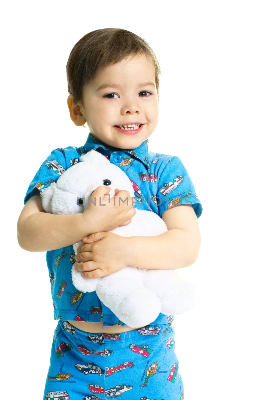 cute little three year old boy holding a toy bear 