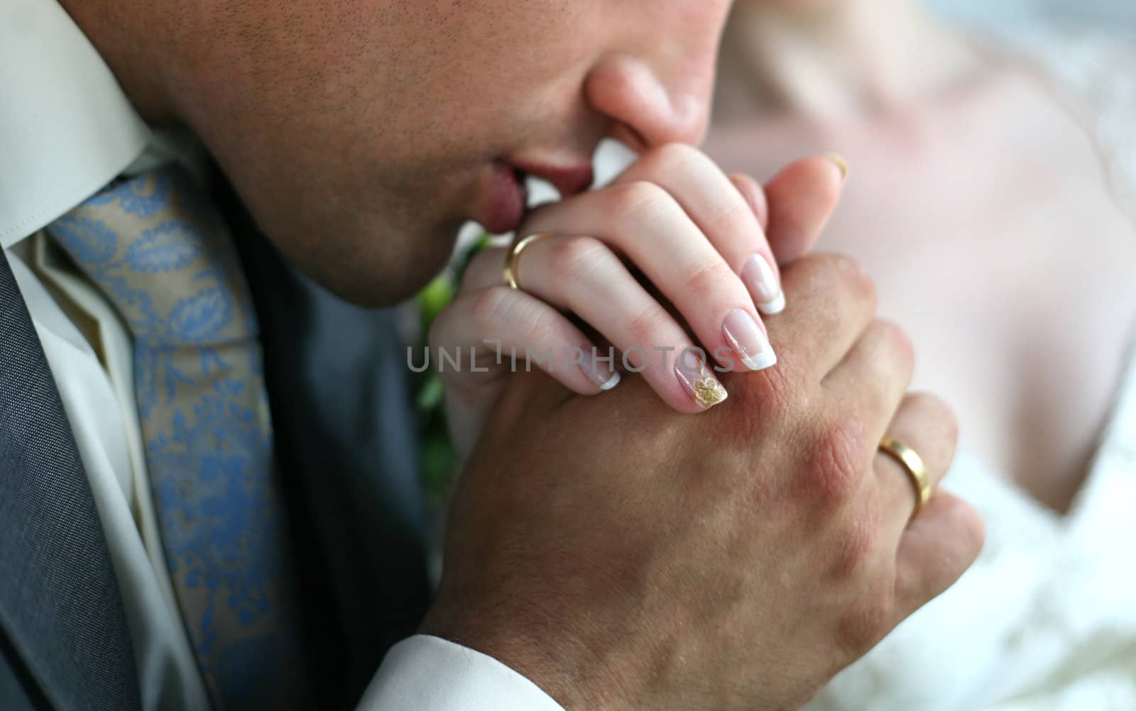 The groom kisses a hand to the bride