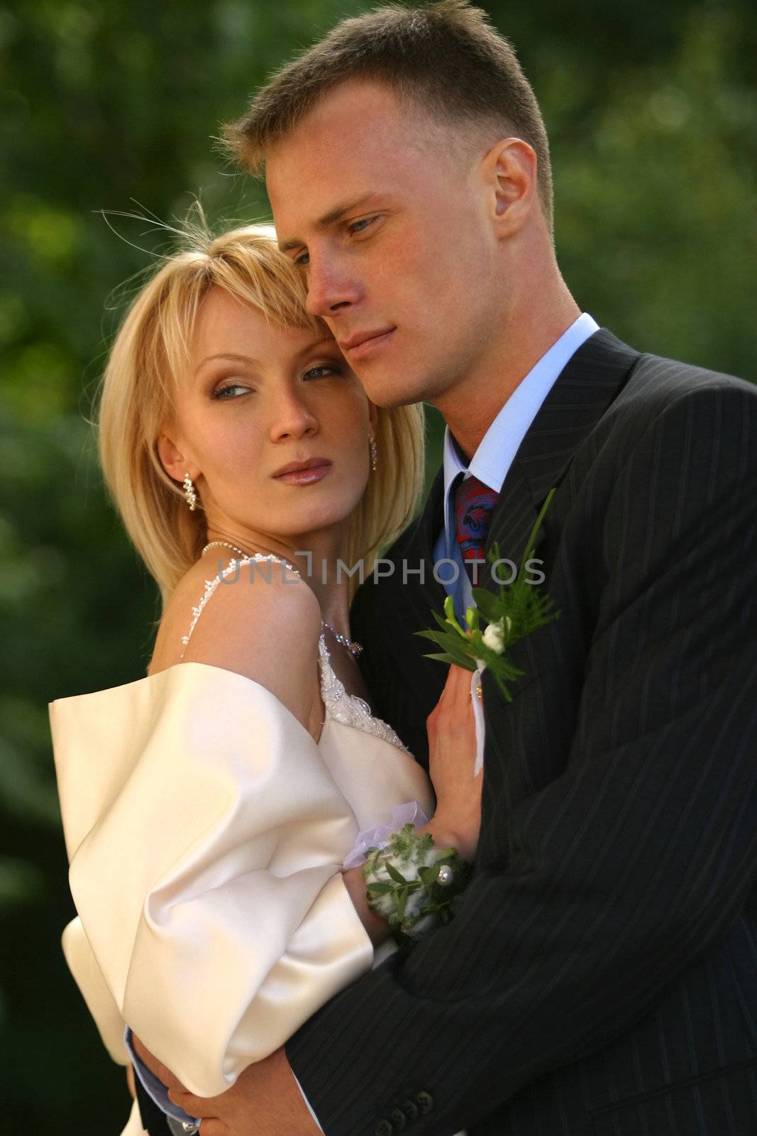 The groom and the bride in park