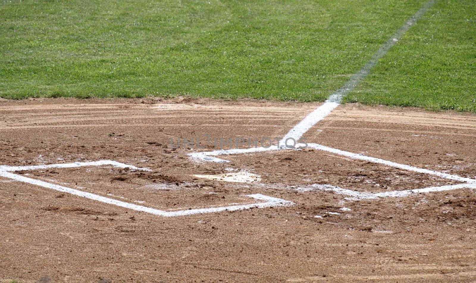 A closeup view of home plate on a baseball field