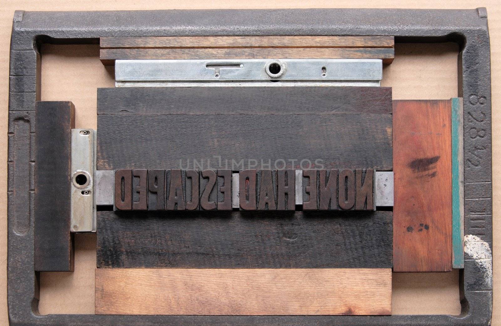 a printer's chase holds wood type ready for the press