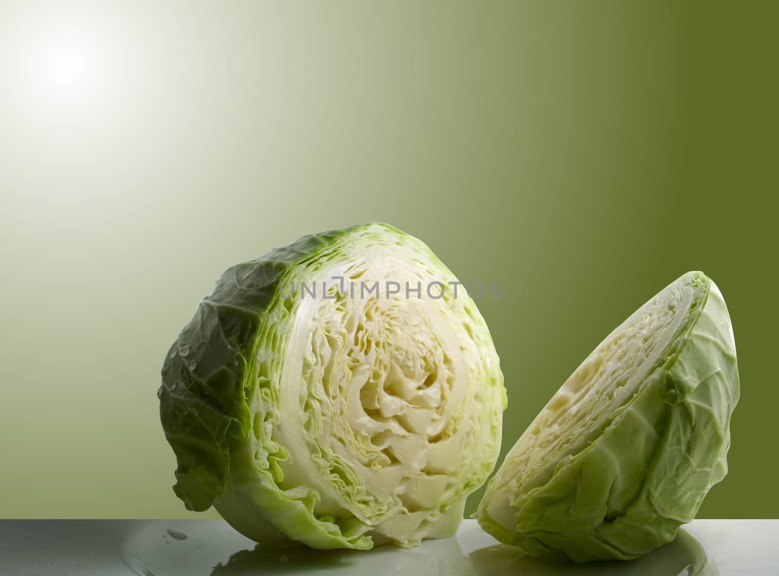 Sliced cabbage with green background