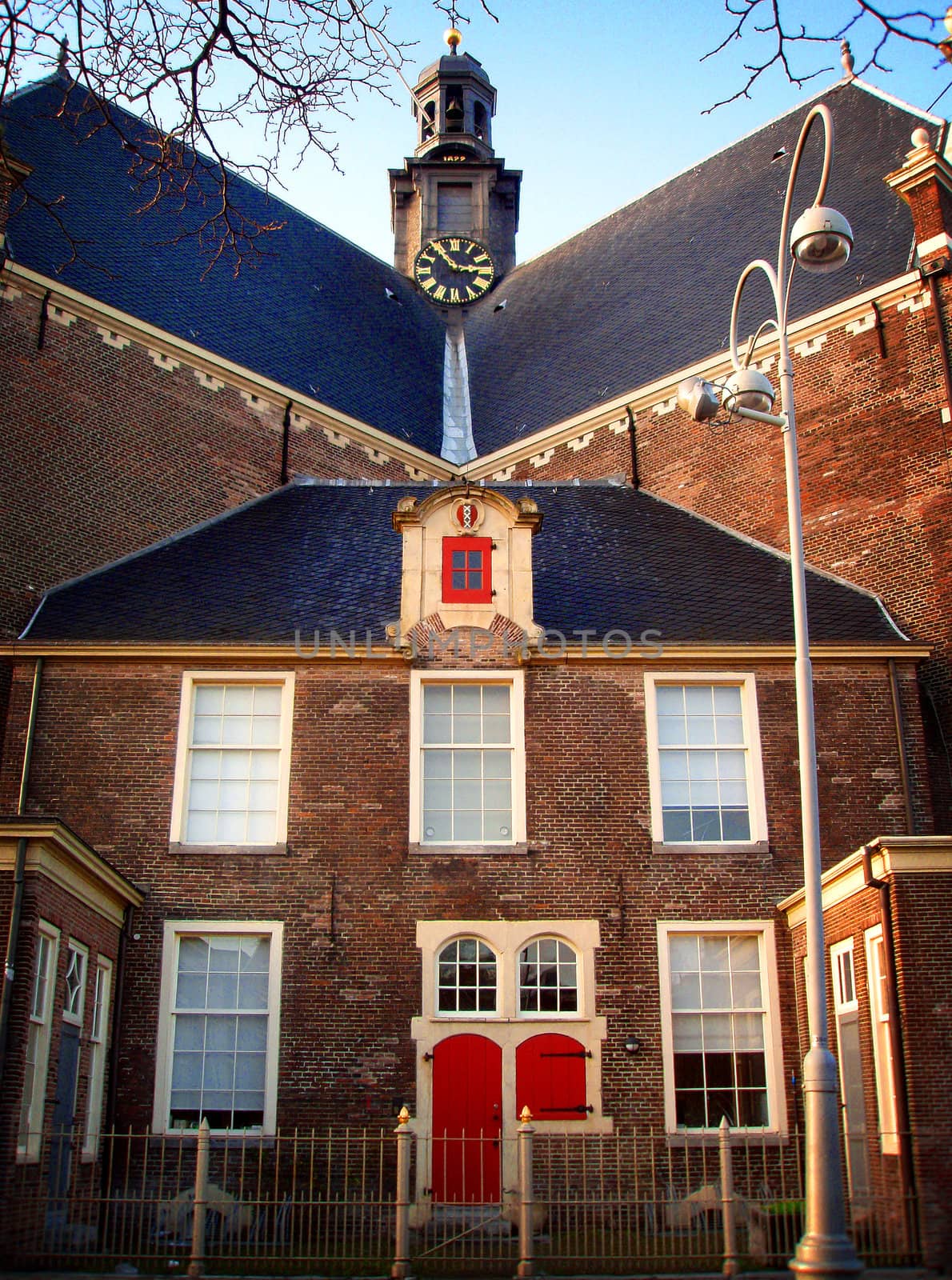 Back of church in Amsterdam with large clock on Belvedere 