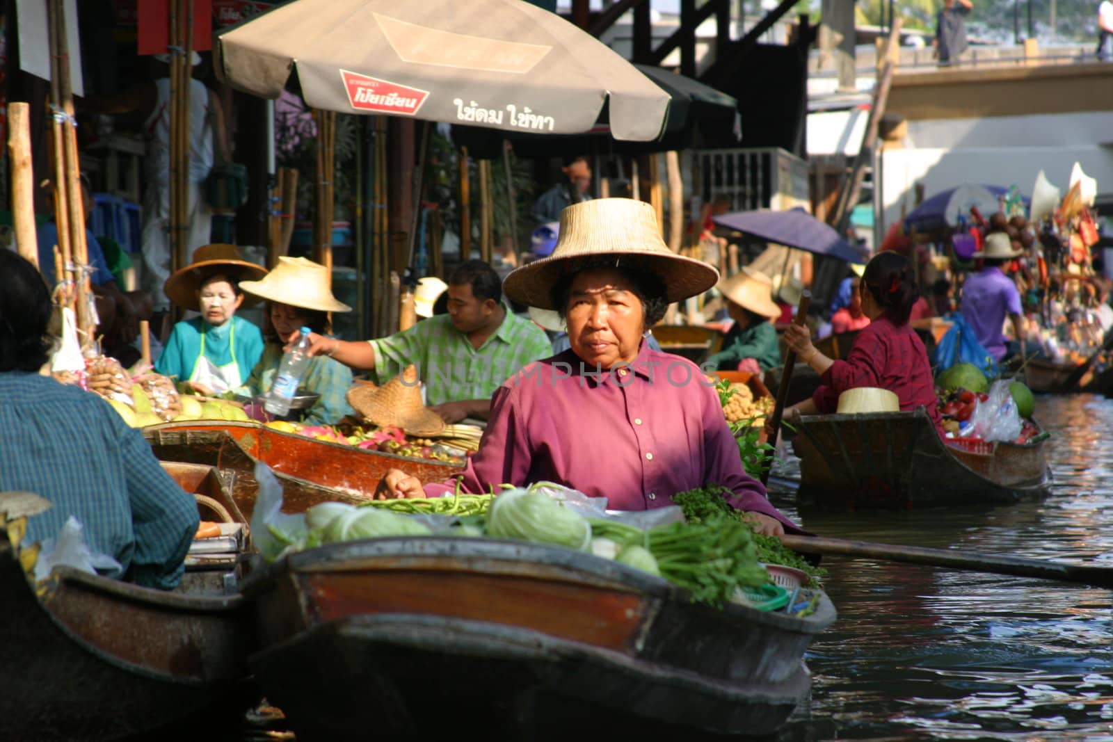 Woman at the floating market Damnoen Saduak in Thailand