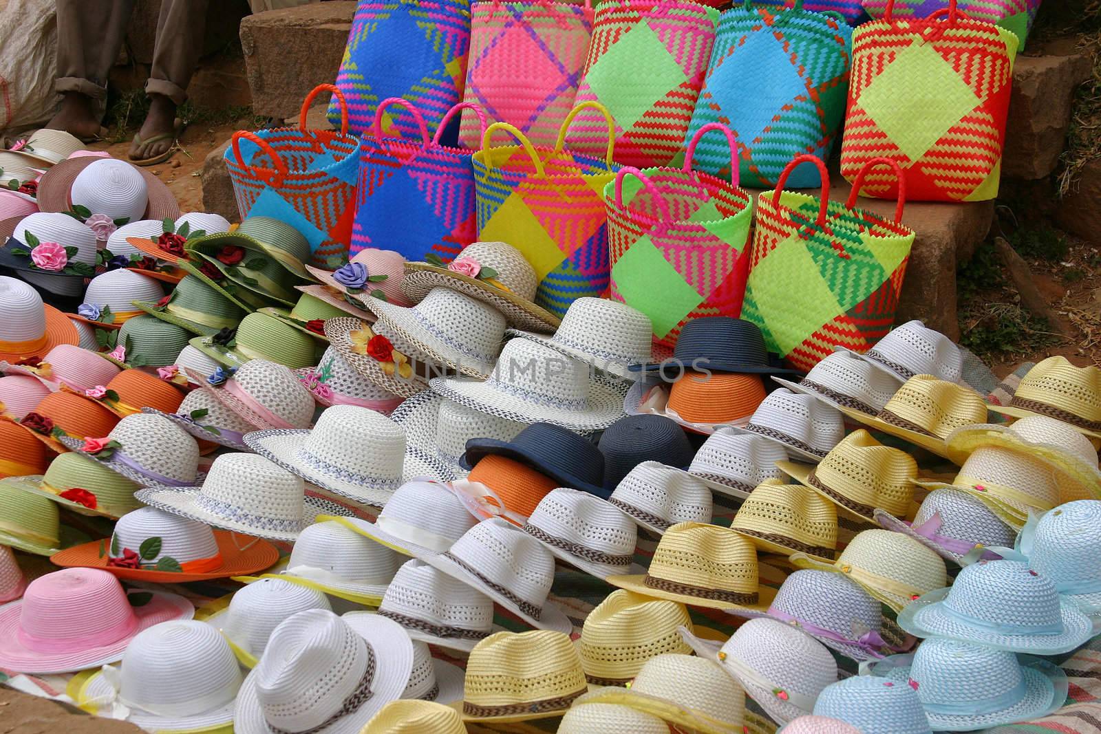 Colorful hats for sale at a market in Ambositra, Madagascar