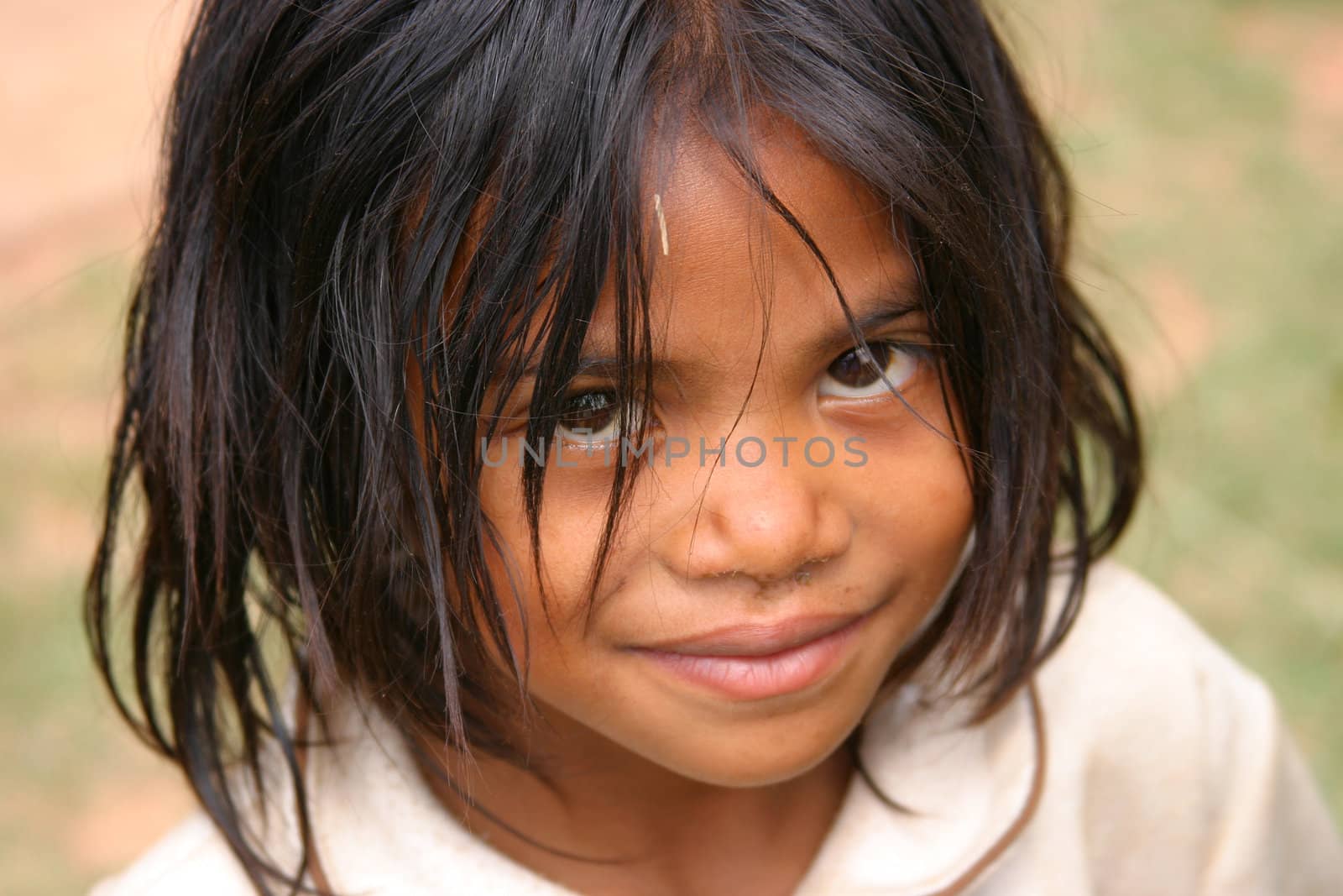 Smiling young girl in Madagascar looking up
