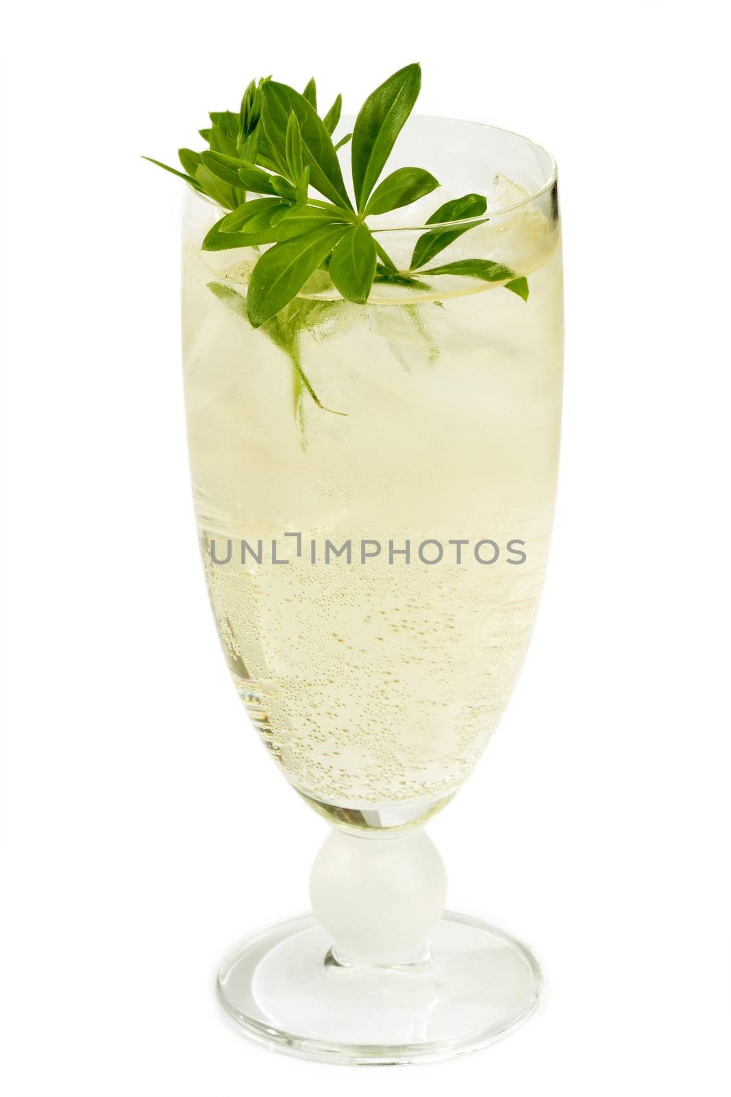 Punch with sweet woodruff herbs on bright background