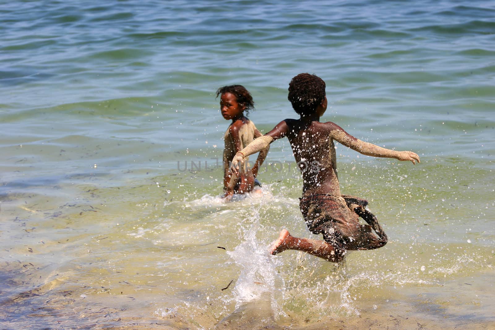 Children playing in the sea at Ifaty, Madagascar
