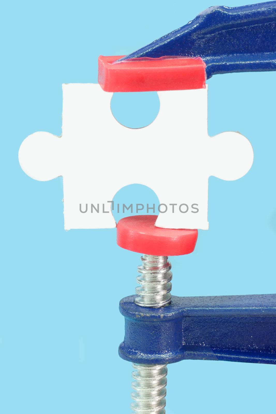Caliber and puzzle, isolated on blue background