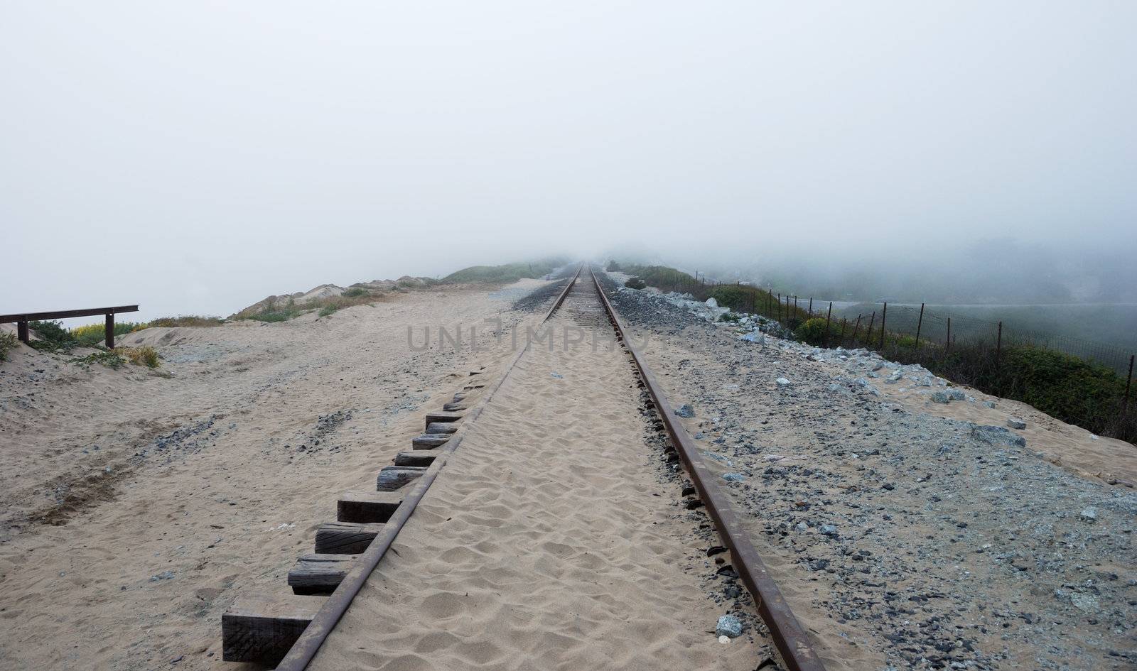 Railroad near California coast disappearing in the Fog.