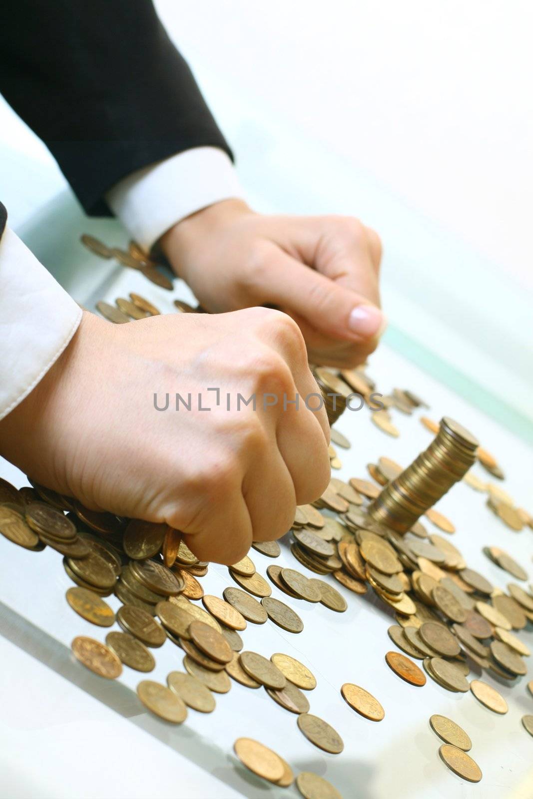 hand make coins piles on white