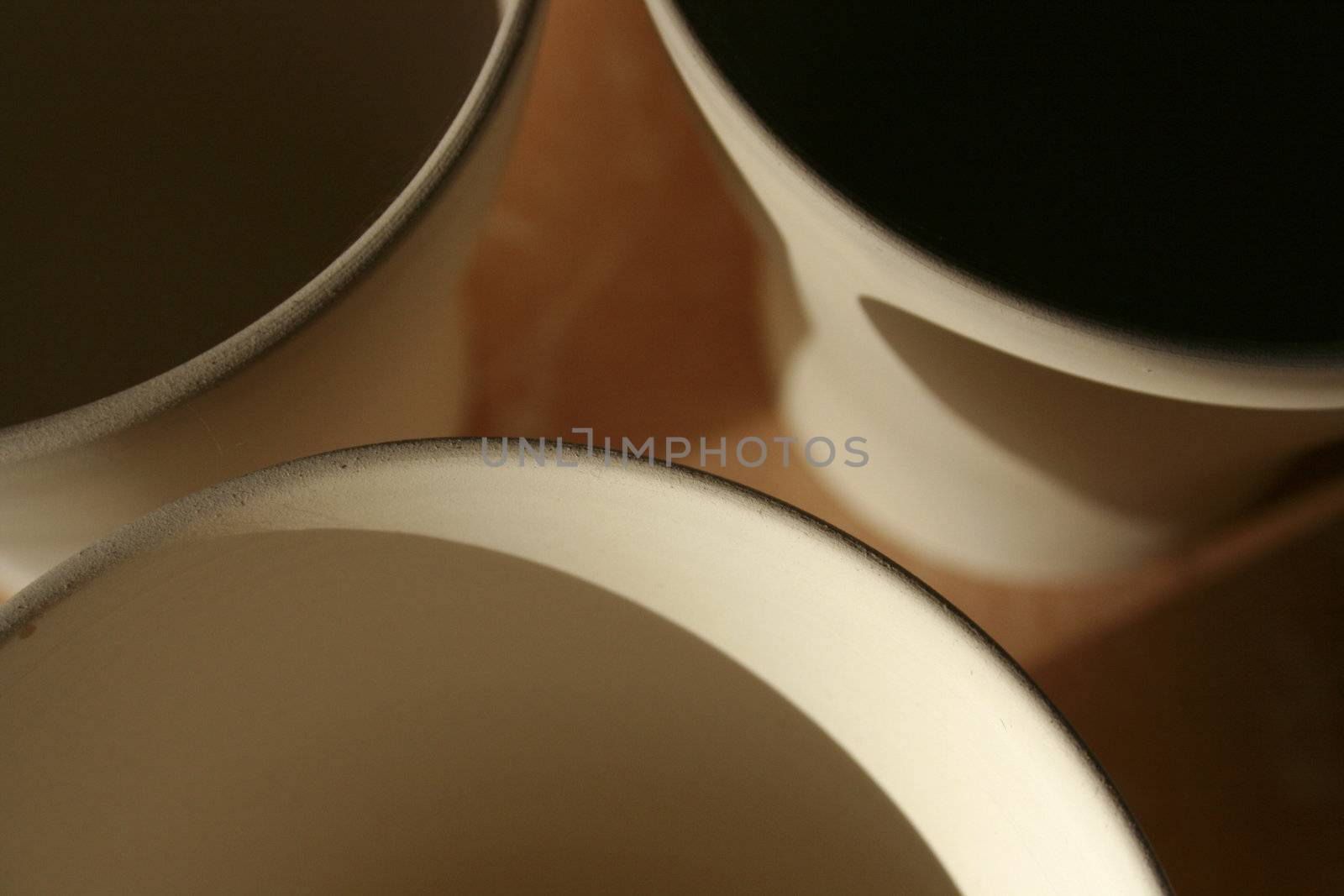 three unfinished coffee mugs as seen from above