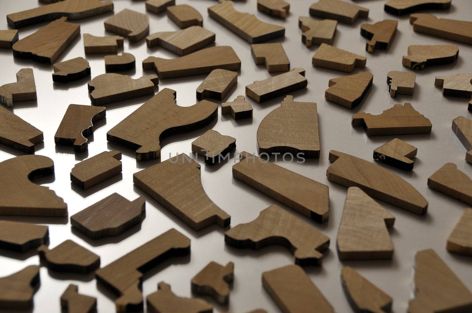 Slices of wooden picture frames on glossy surface