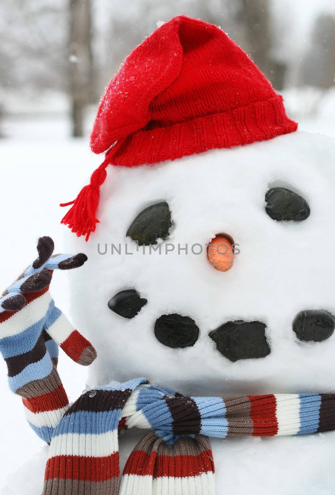 Smiley face snowman with a red hat