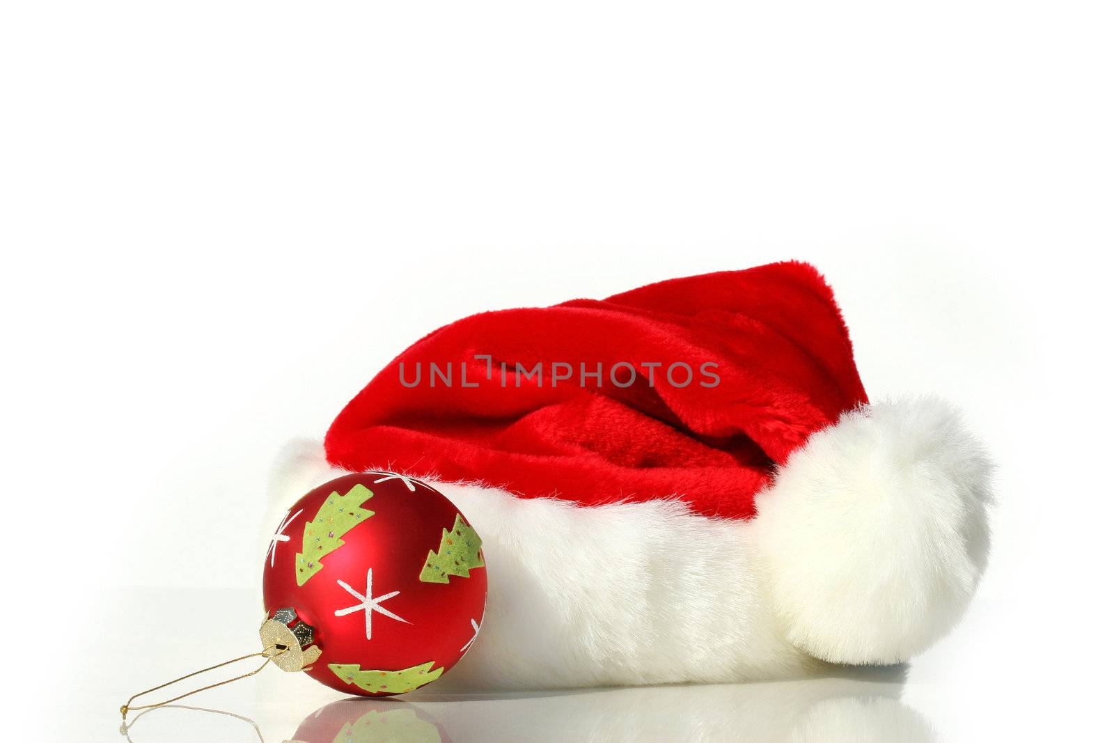 Santa hat with red christmas ball isolated on white background