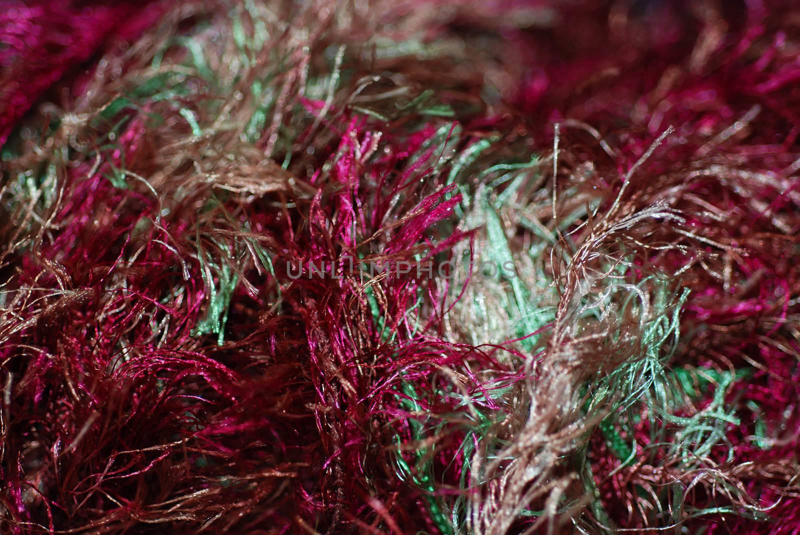 A close up macro photograph of colourful fibers