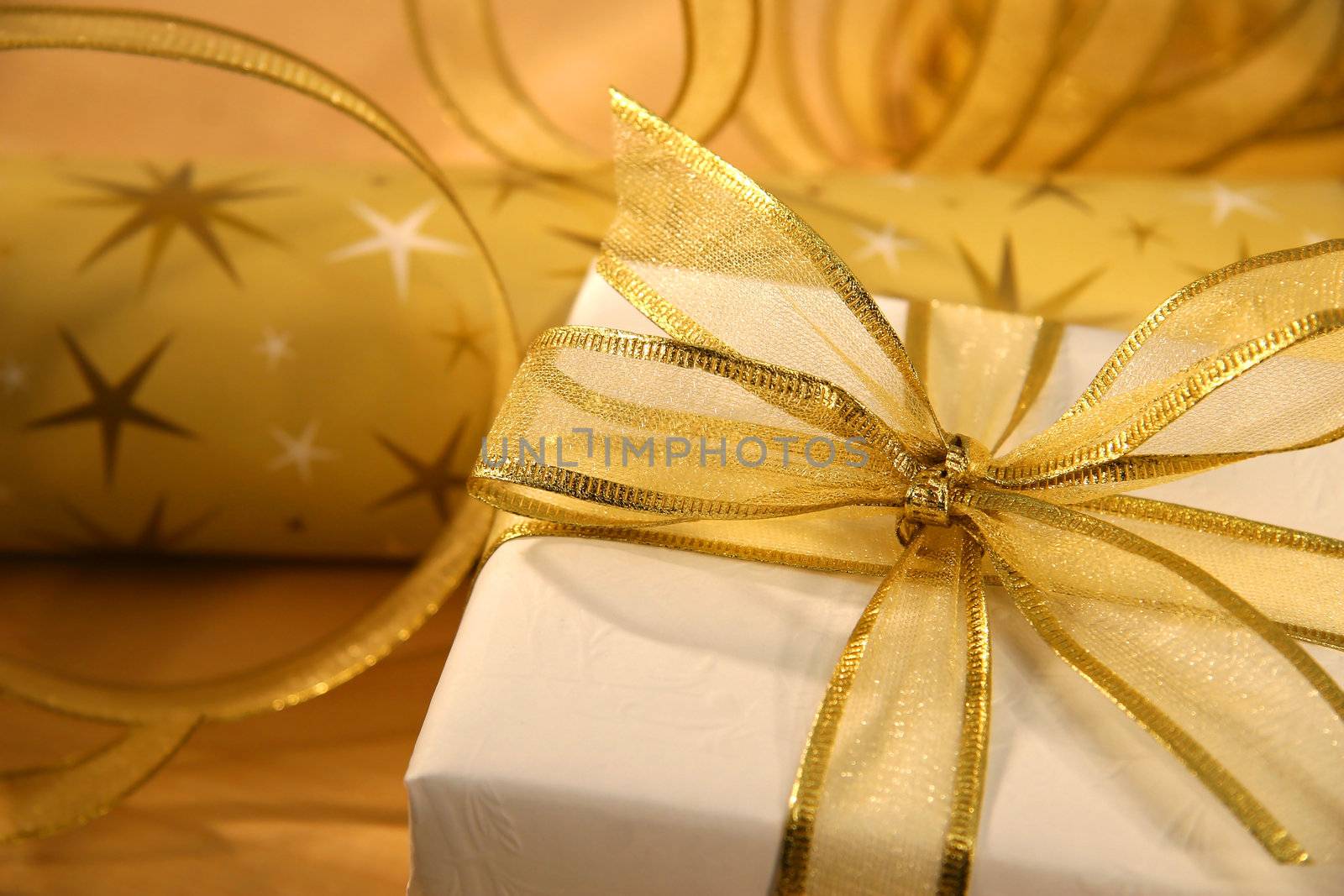Gold bow on holiday wrapping