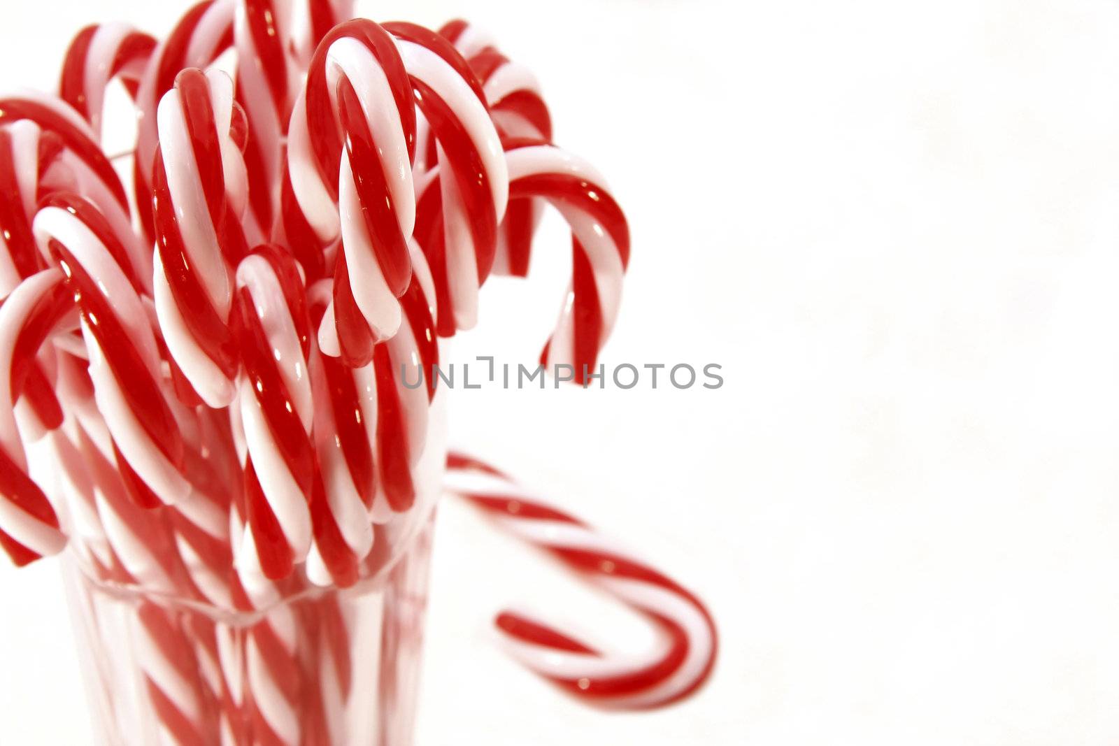 Lots of candy canes on isolated background