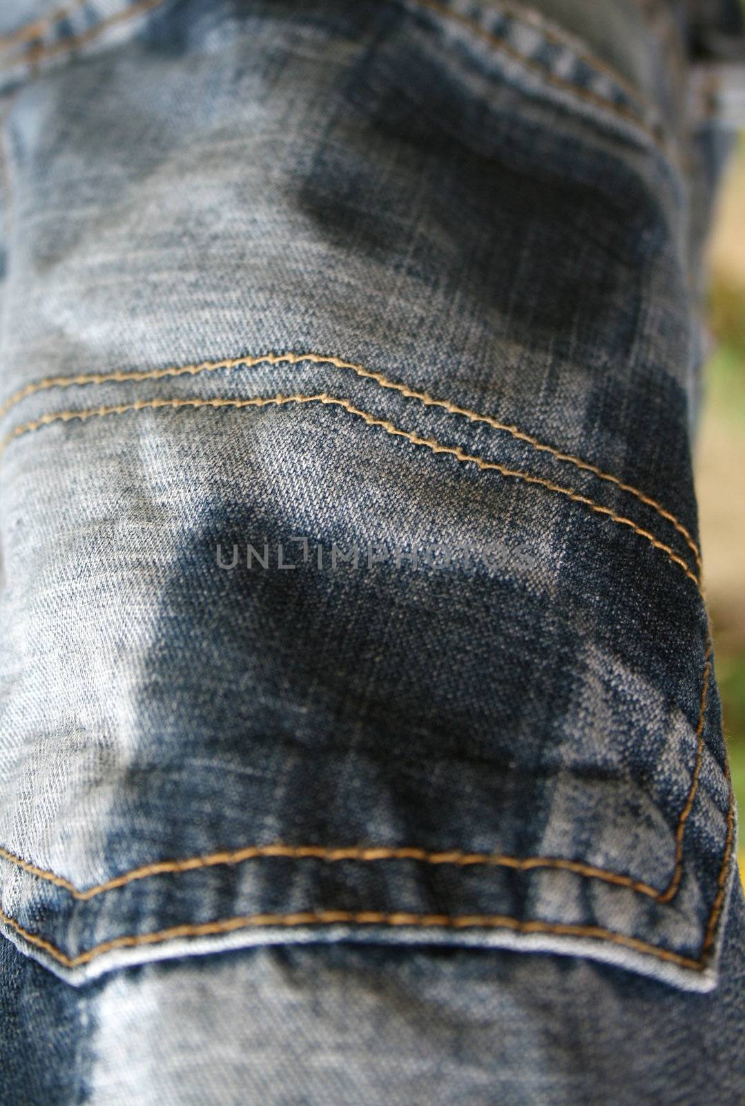 macro shot of the back pocket of jeans