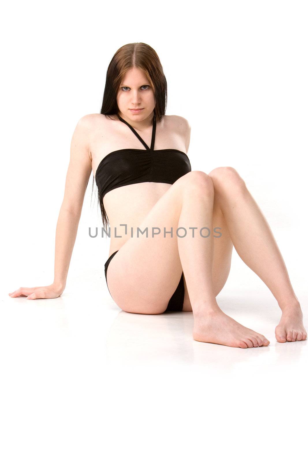 sexy girl in black bikini sitting on floor