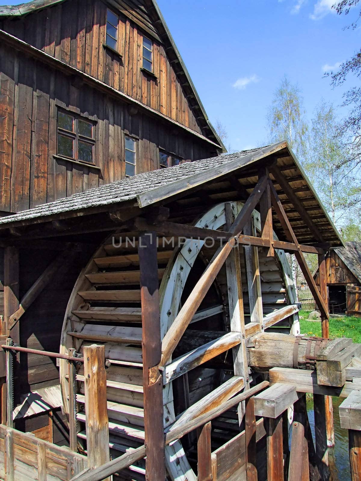 An old mill with water wheel in Poland