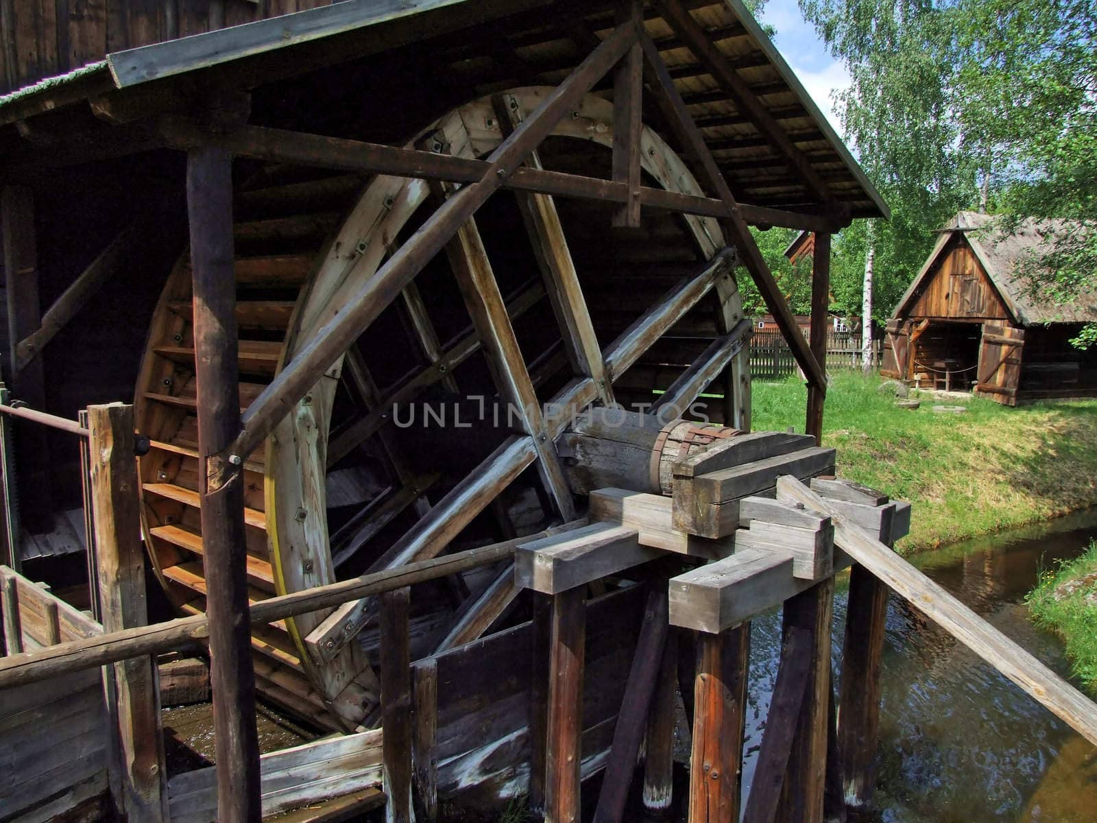 An old mill with water wheel in Poland by anki21