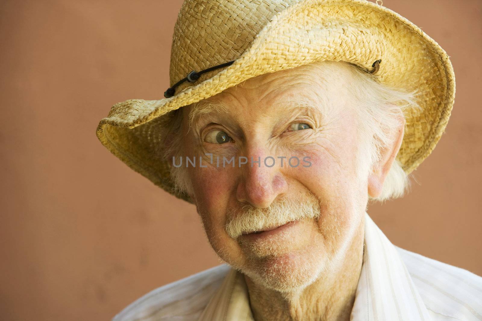 Senior Citizen Man in a Straw Cowboy Hat