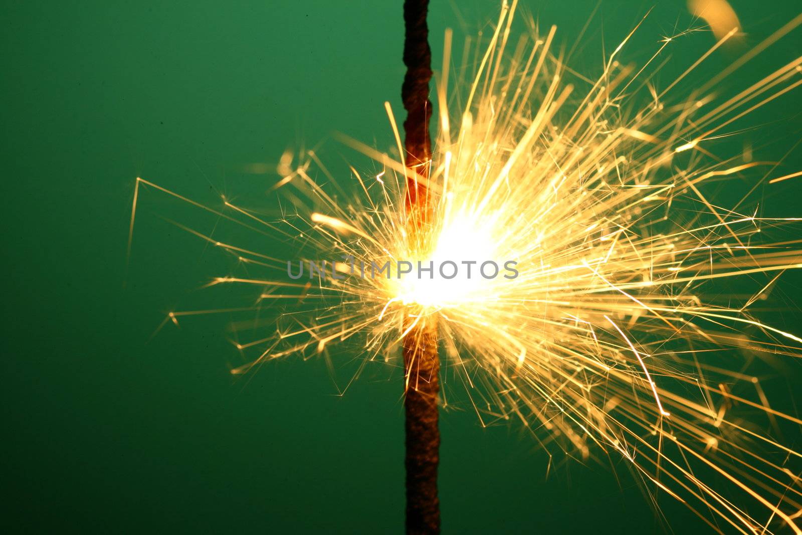 christmas sparkler on green background