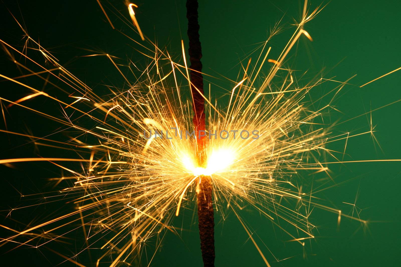 christmas sparkler on green background