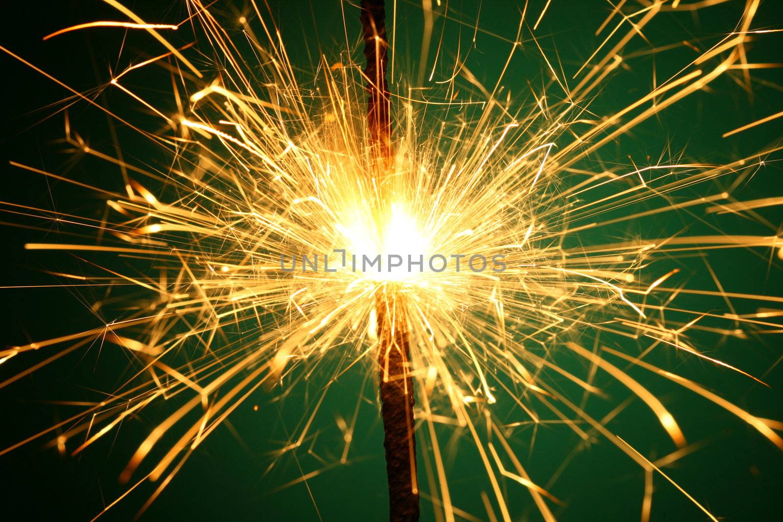 christmas sparkler on green background