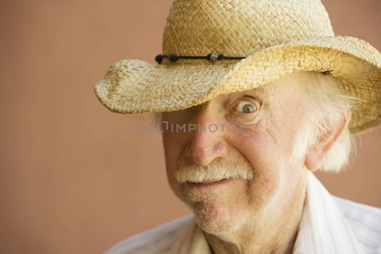 Senior Citizen Man in a Straw Cowboy Hat