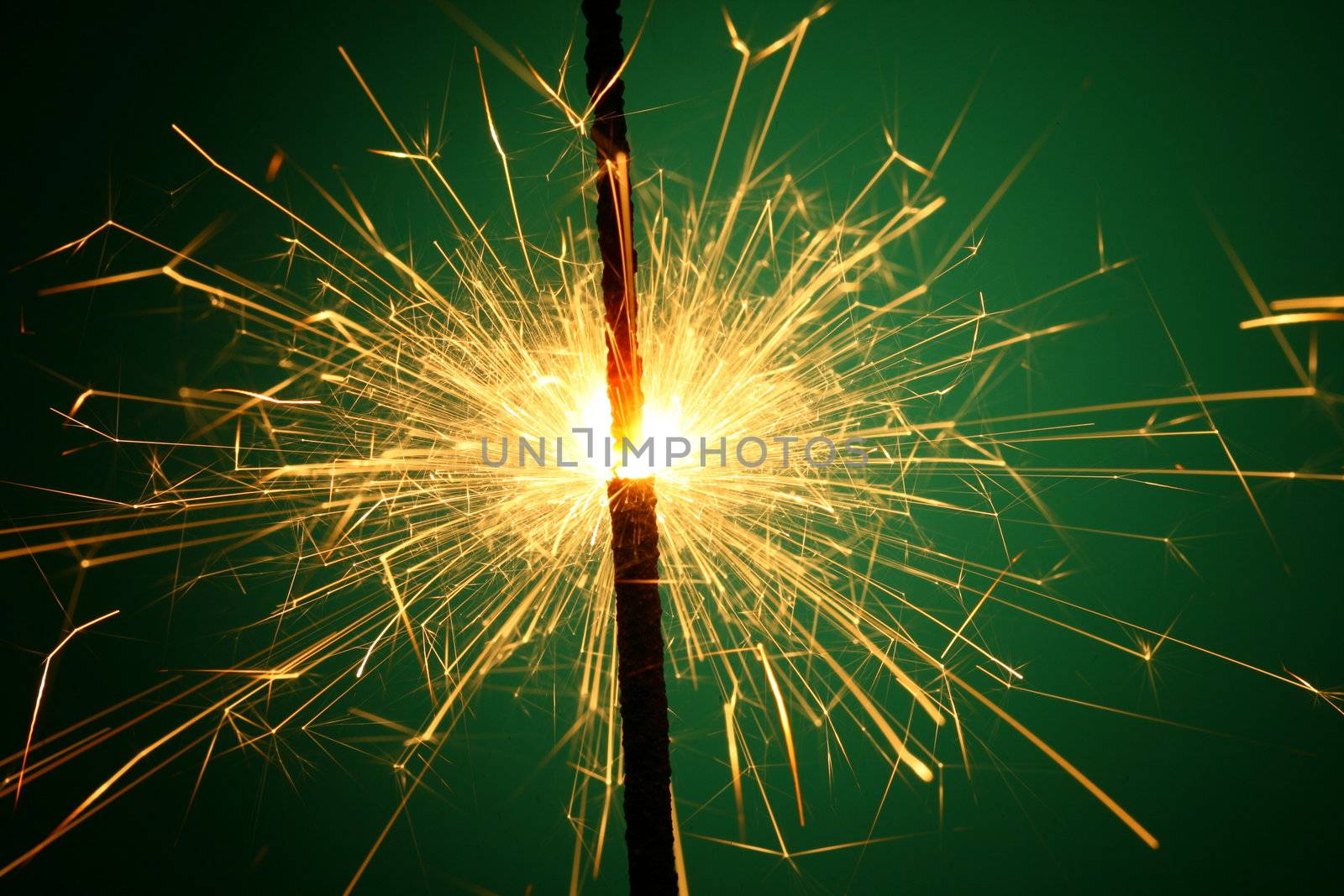 christmas sparkler on green background