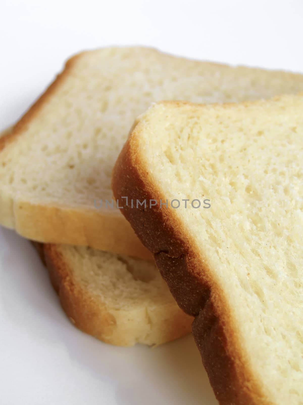 fresh wheaten bread to toasts by anki21