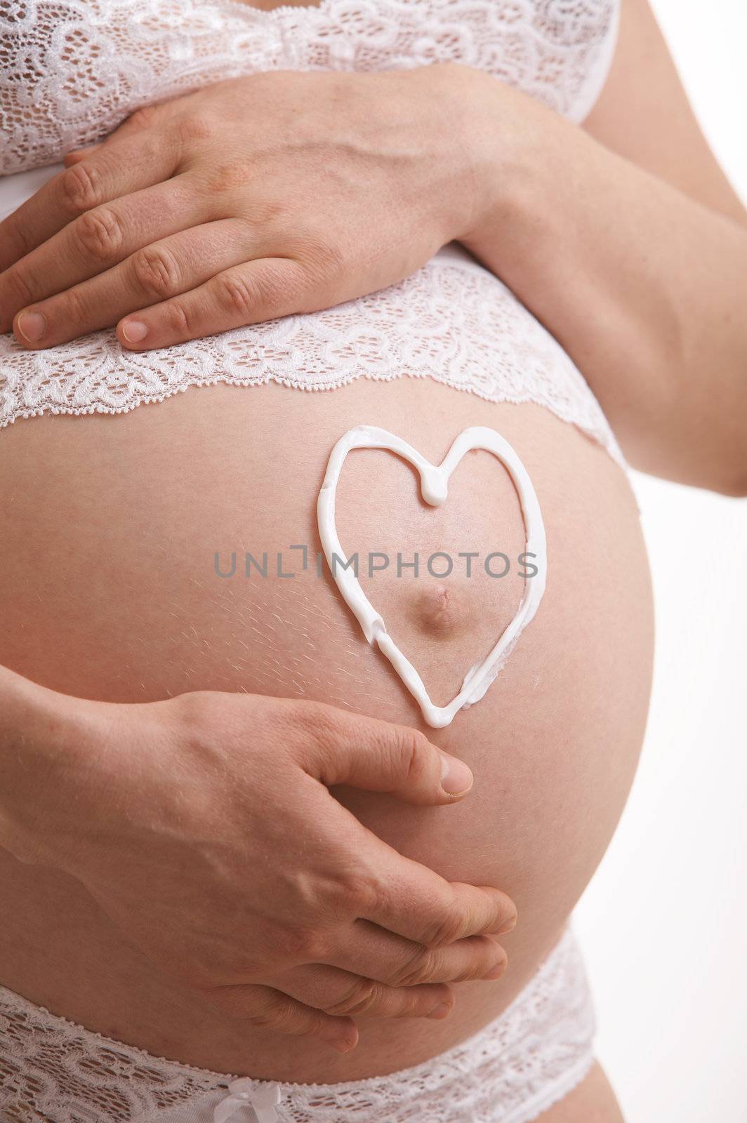 love symbol on the expectant mother stomach