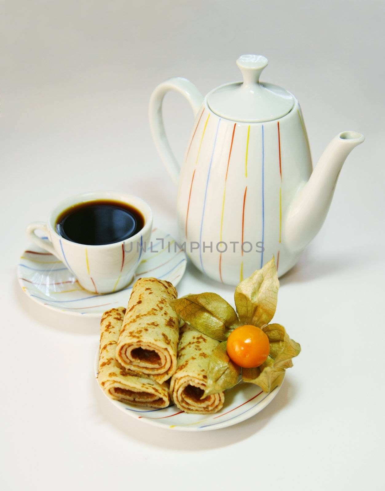 The curtailed braided, a teapot and a cup from coffee on a white background