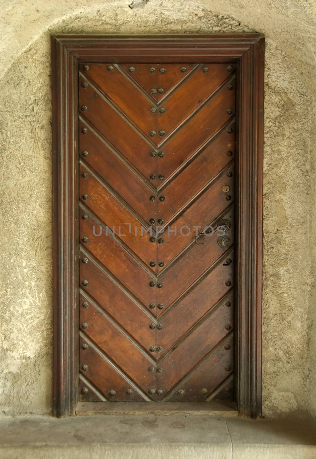 Door of a building in castle, Poland by anki21