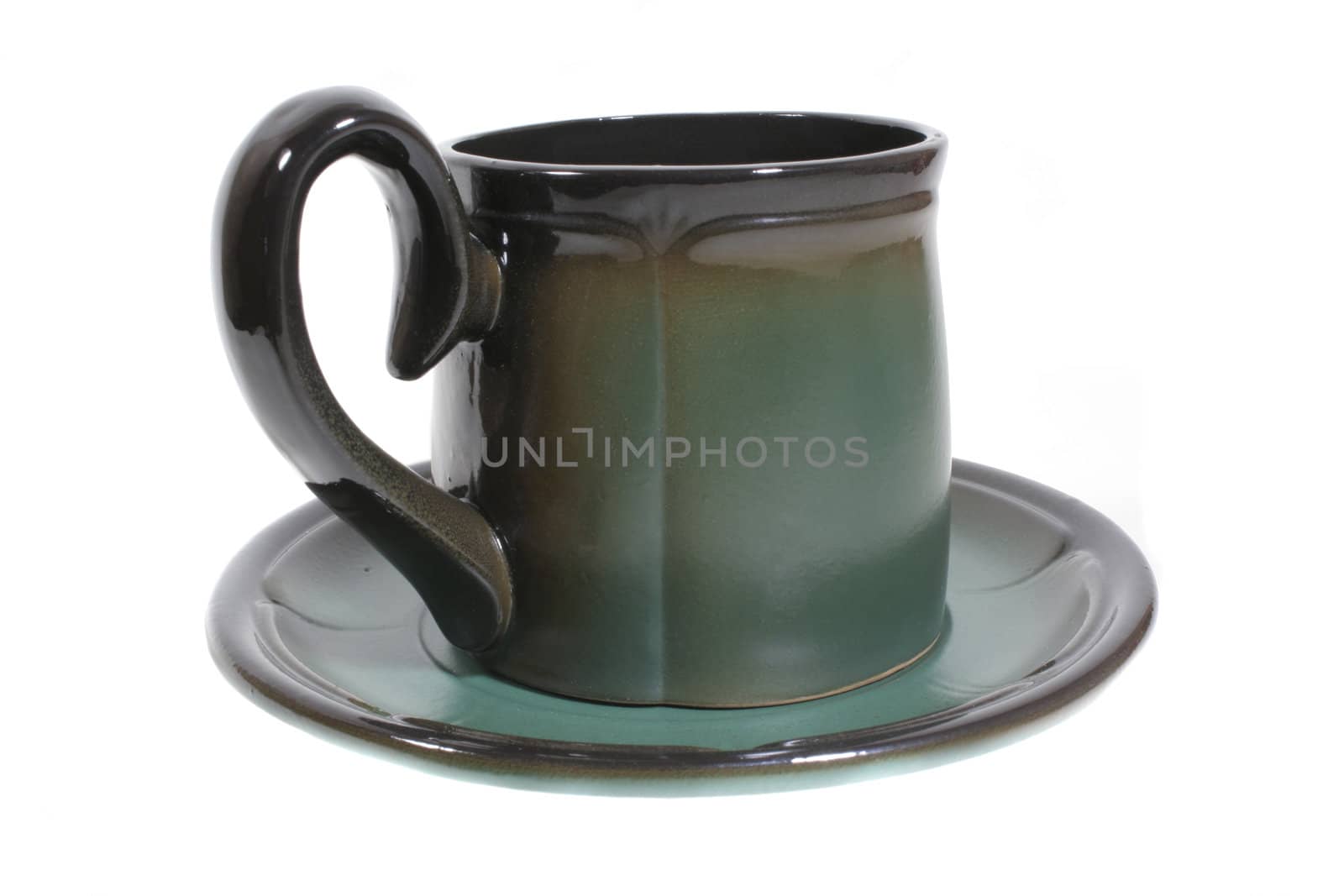 Large green ceramic tea cup on saucer