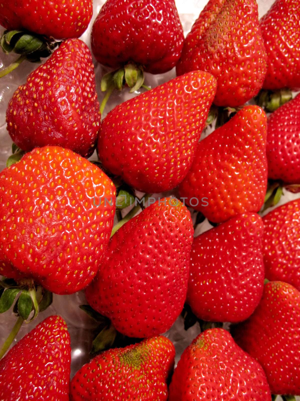 An arrangement of some bright red strawberries.